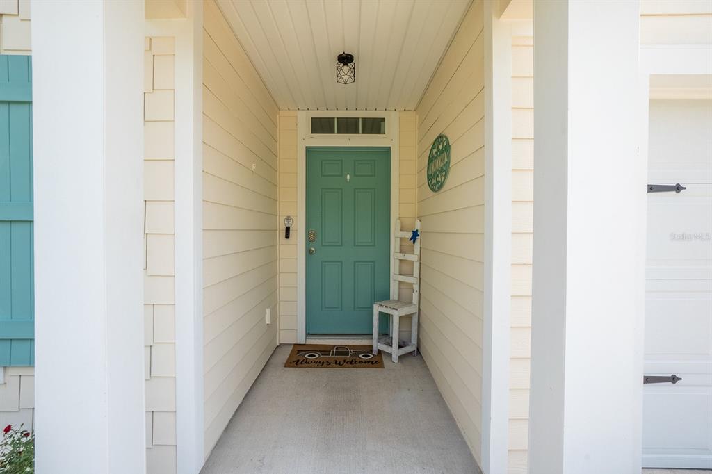 15 Grand Par Court Bunnell, FL 32110 - Photo 3 of 61 a view of a hallway with wooden floor and door