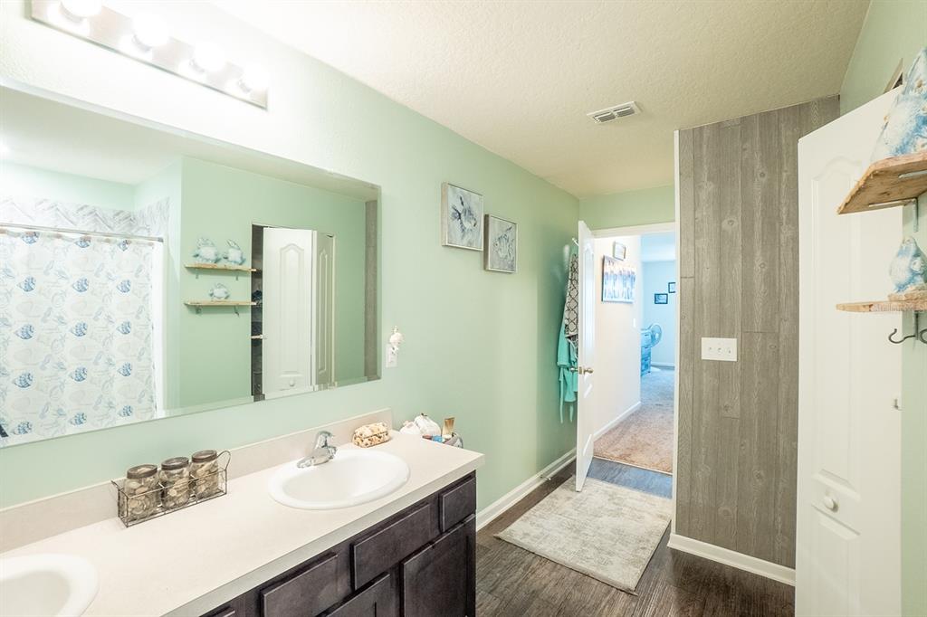 15 Grand Par Court Bunnell, FL 32110 - Photo 32 of 61 a bathroom with a sink and a mirror