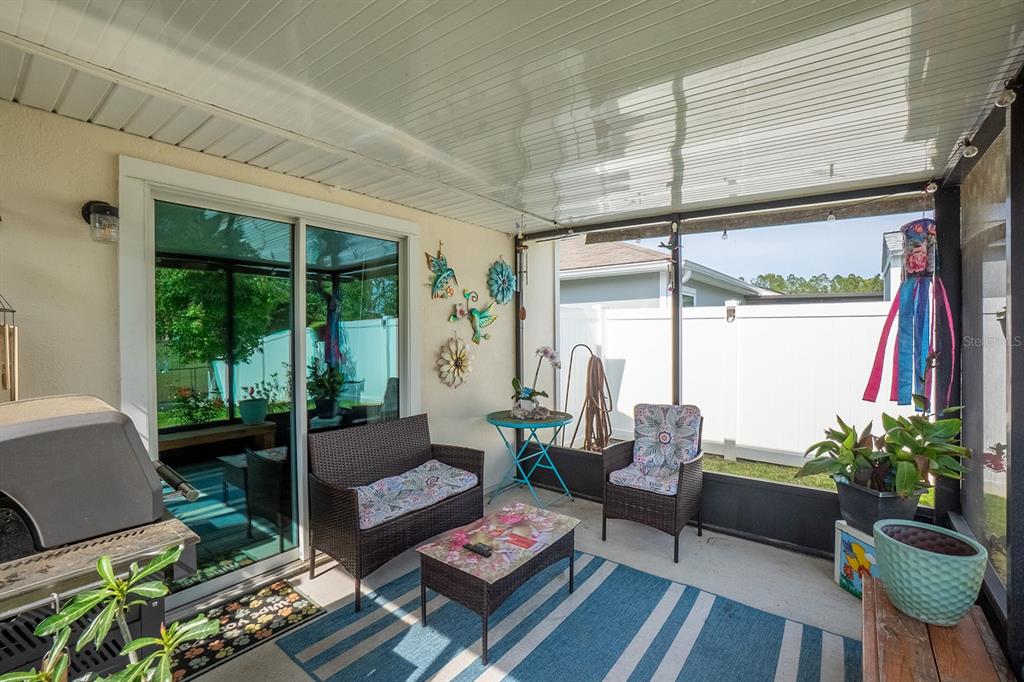 15 Grand Par Court Bunnell, FL 32110 - Photo 35 of 61 a living room with furniture and a large window