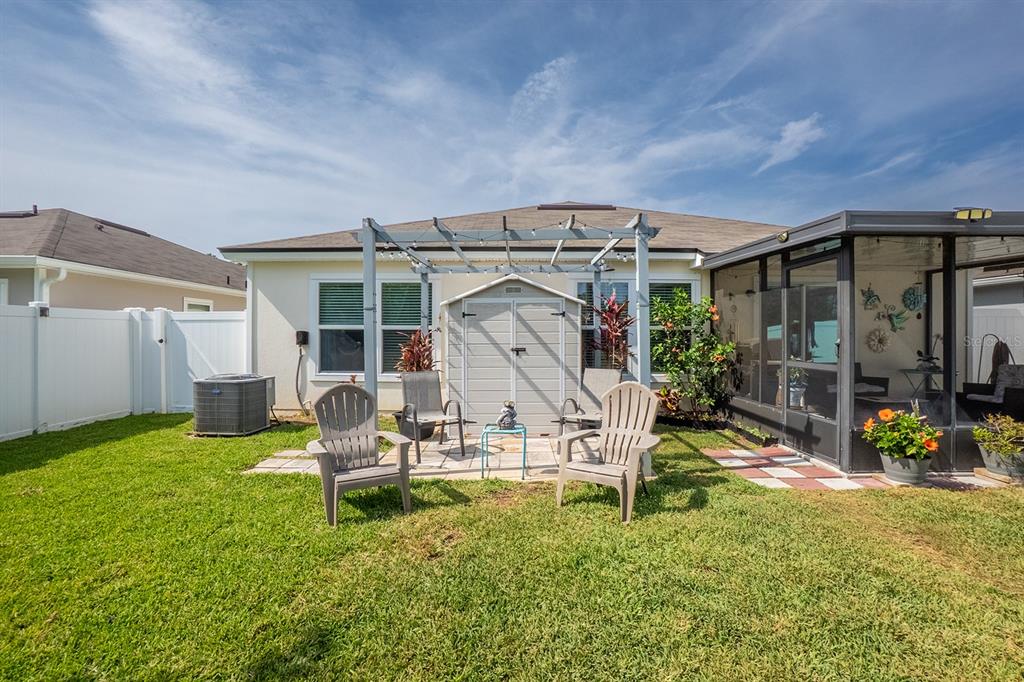 15 Grand Par Court Bunnell, FL 32110 - Photo 37 of 61 a view of a chair and table in front of a house