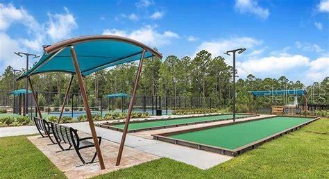 15 Grand Par Court Bunnell, FL 32110 - Photo 54 of 61 a view of a chairs and table in the yard