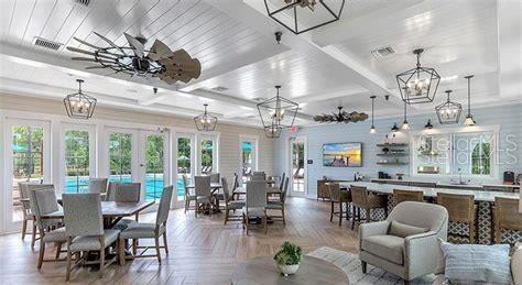 15 Grand Par Court Bunnell, FL 32110 - Photo 57 of 61 a living room with lots of furniture and chandelier