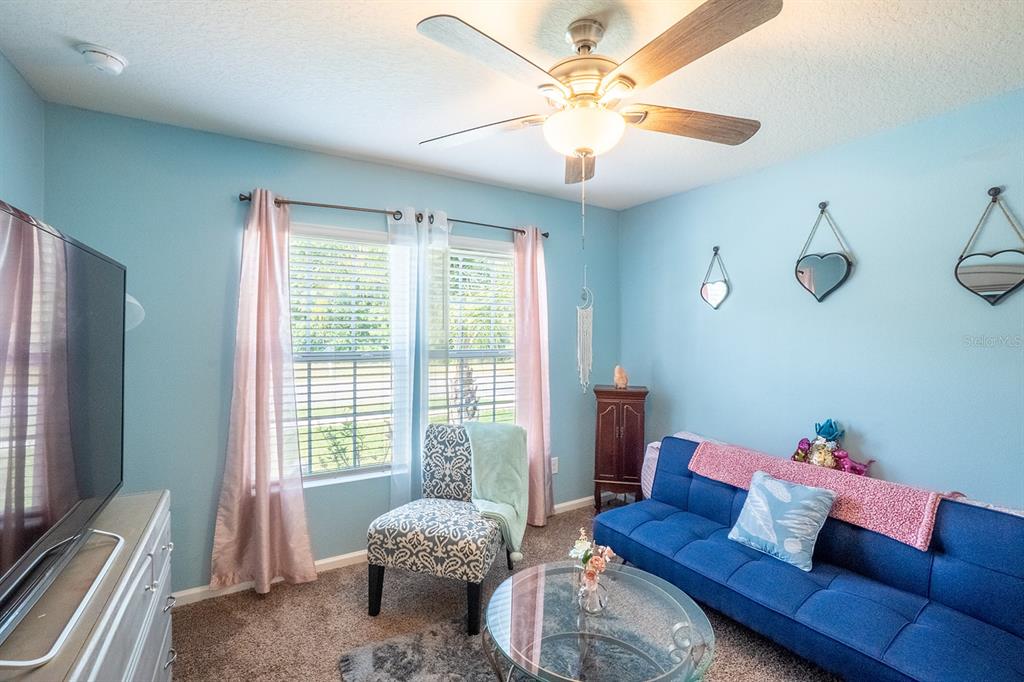 15 Grand Par Court Bunnell, FL 32110 - Photo 6 of 61 a living room with furniture and a large window