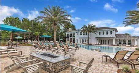 15 Grand Par Court Bunnell, FL 32110 - Photo 61 of 61 a view of a patio with couches table and chairs and potted plants