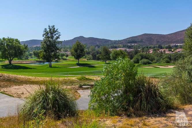 529 Fairfield Road Simi Valley, CA 93065 - Photo 1 of 21 a view of a lush green outdoor space with a lake view