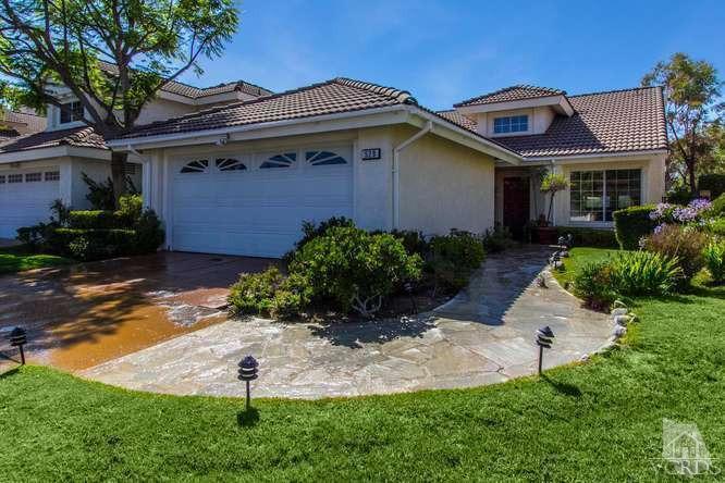 529 Fairfield Road Simi Valley, CA 93065 - Photo 2 of 21 a front view of a house with a yard and garage