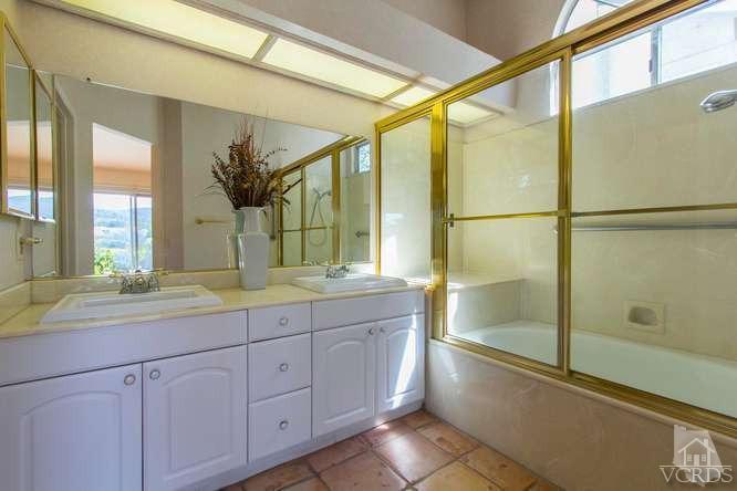529 Fairfield Road Simi Valley, CA 93065 - Photo 13 of 21 a bathroom with a granite countertop sink mirror and double
