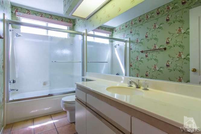 529 Fairfield Road Simi Valley, CA 93065 - Photo 15 of 21 a bathroom with a granite countertop bathtub shower sink vanity and toilet