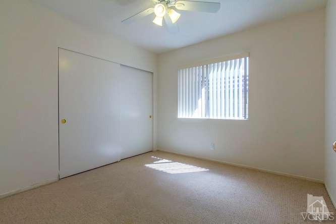 529 Fairfield Road Simi Valley, CA 93065 - Photo 16 of 21 an empty room with a window and a chandelier fan