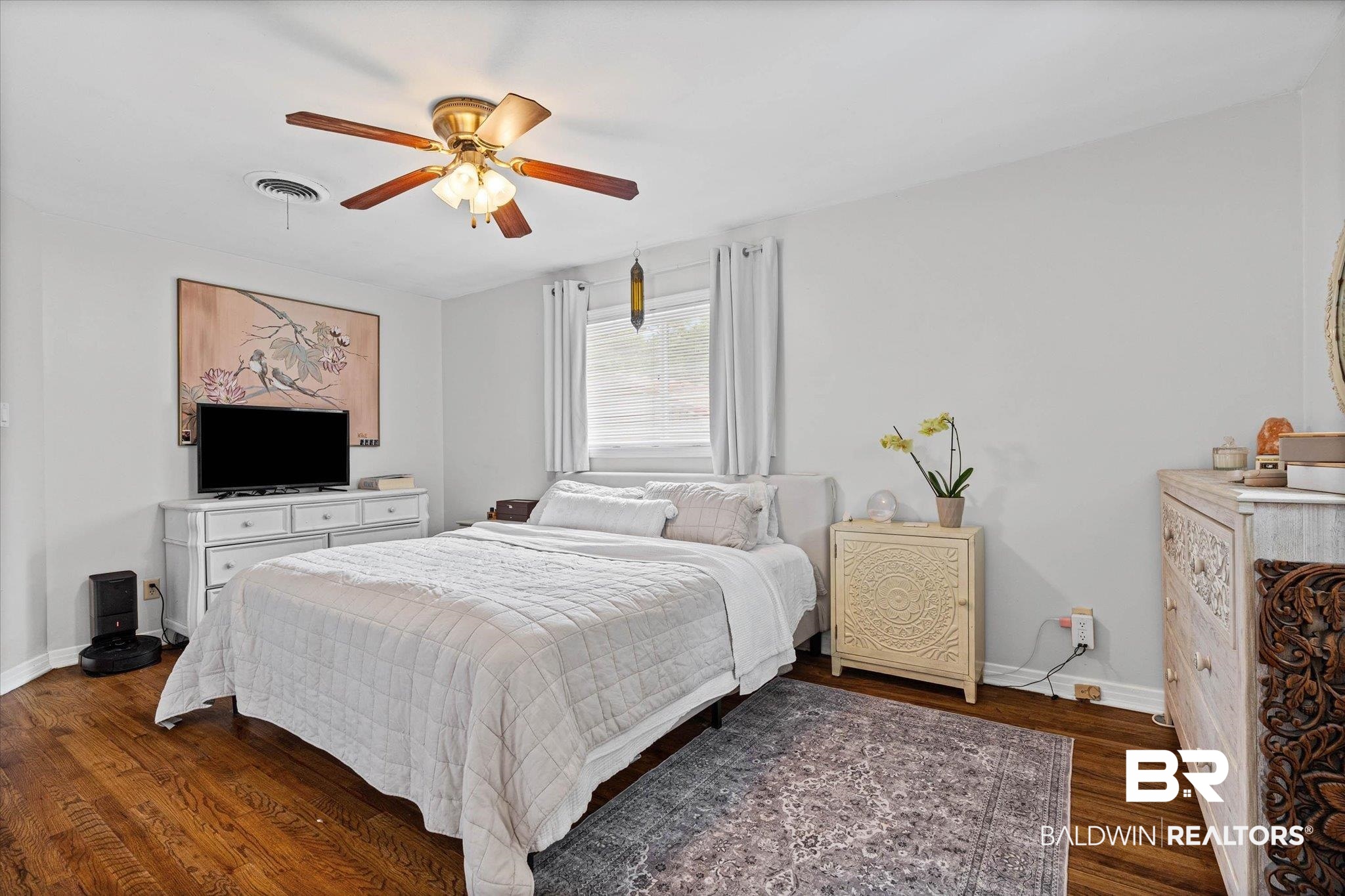 4213 Shan Drive East Mobile, AL 36693 - Photo 14 of 35 Room featuring wood-finish flooring, a ceiling fan with integrated lighting, and a single window with blinds