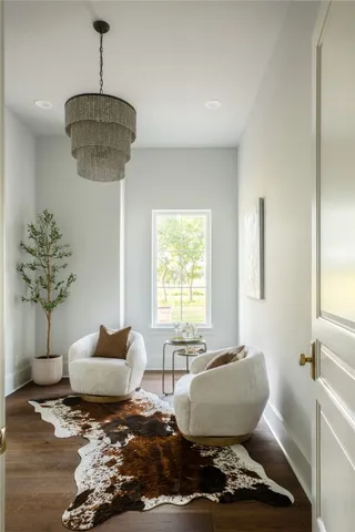 a bedroom with a bed a couch and a window