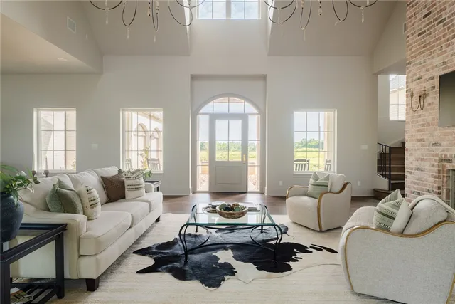 a living room with furniture fireplace and flat screen tv