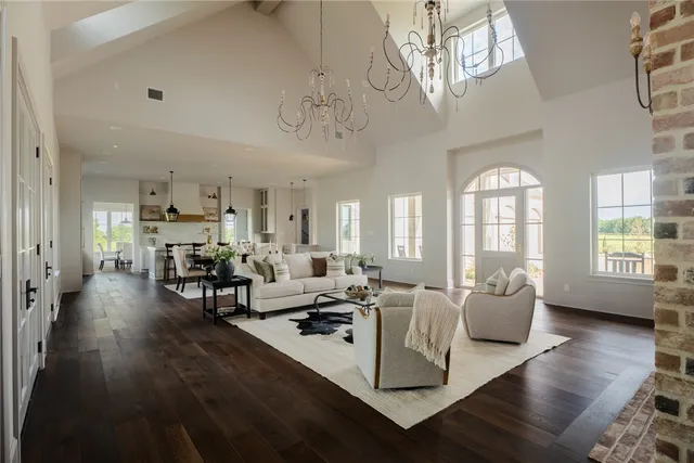 a view of living room with furniture and wooden floor