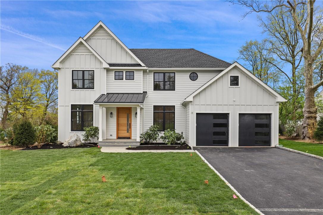 6 Elm Hill Drive Rye Brook, NY 10573 - Photo 1 of 1 a front view of a house with a yard and porch