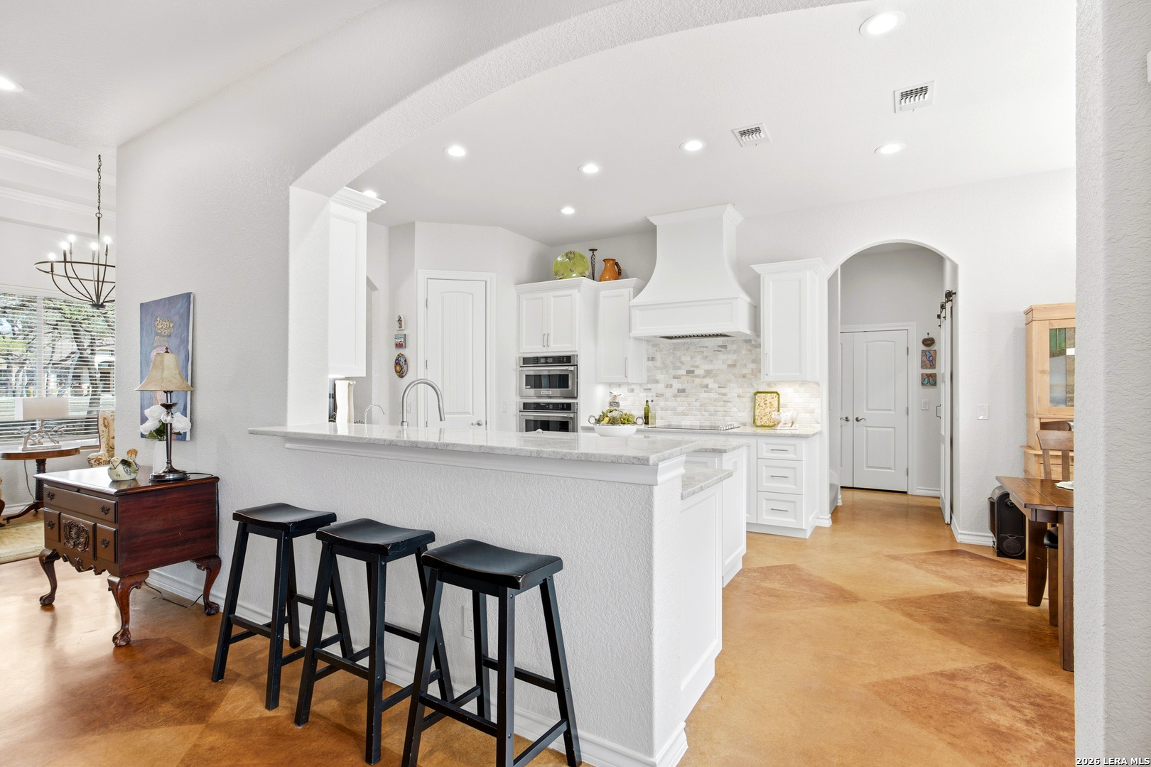 541 Saxet Trail Spring Branch, TX 78070 - Photo 14 of 59 a kitchen with a table chairs refrigerator and cabinets