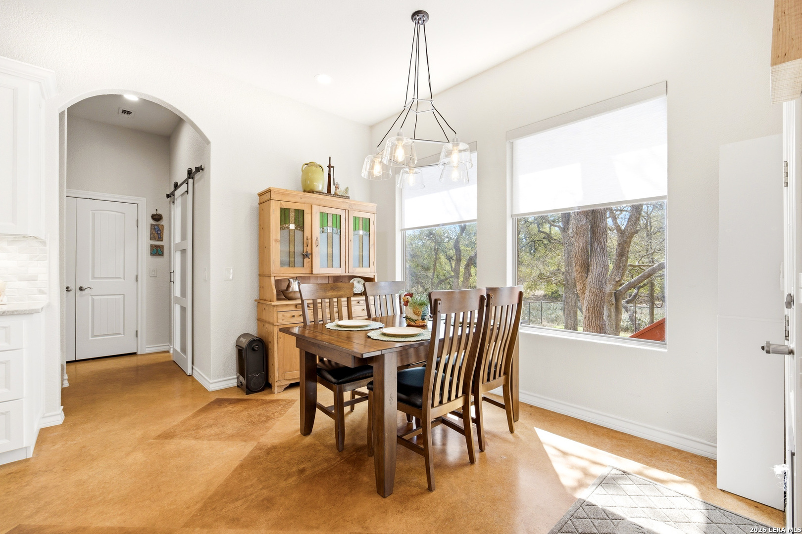 541 Saxet Trail Spring Branch, TX 78070 - Photo 19 of 59 a view of a dining room with furniture window and outside view