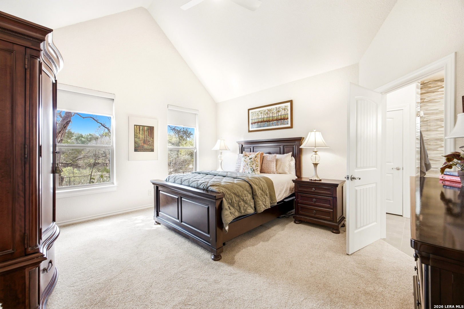 541 Saxet Trail Spring Branch, TX 78070 - Photo 20 of 59 a bedroom with a bed lamp and a large window