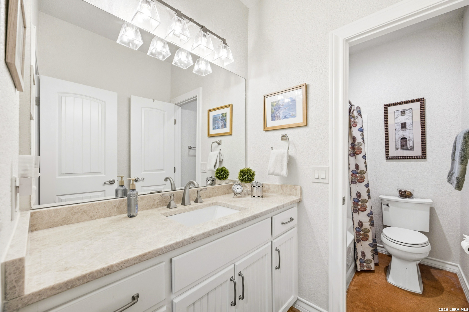 541 Saxet Trail Spring Branch, TX 78070 - Photo 27 of 59 a bathroom with a granite countertop sink a toilet and a mirror
