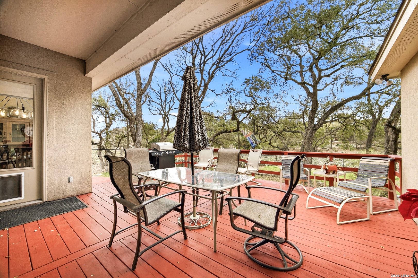 541 Saxet Trail Spring Branch, TX 78070 - Photo 32 of 59 a view of a chairs and tables on the deck