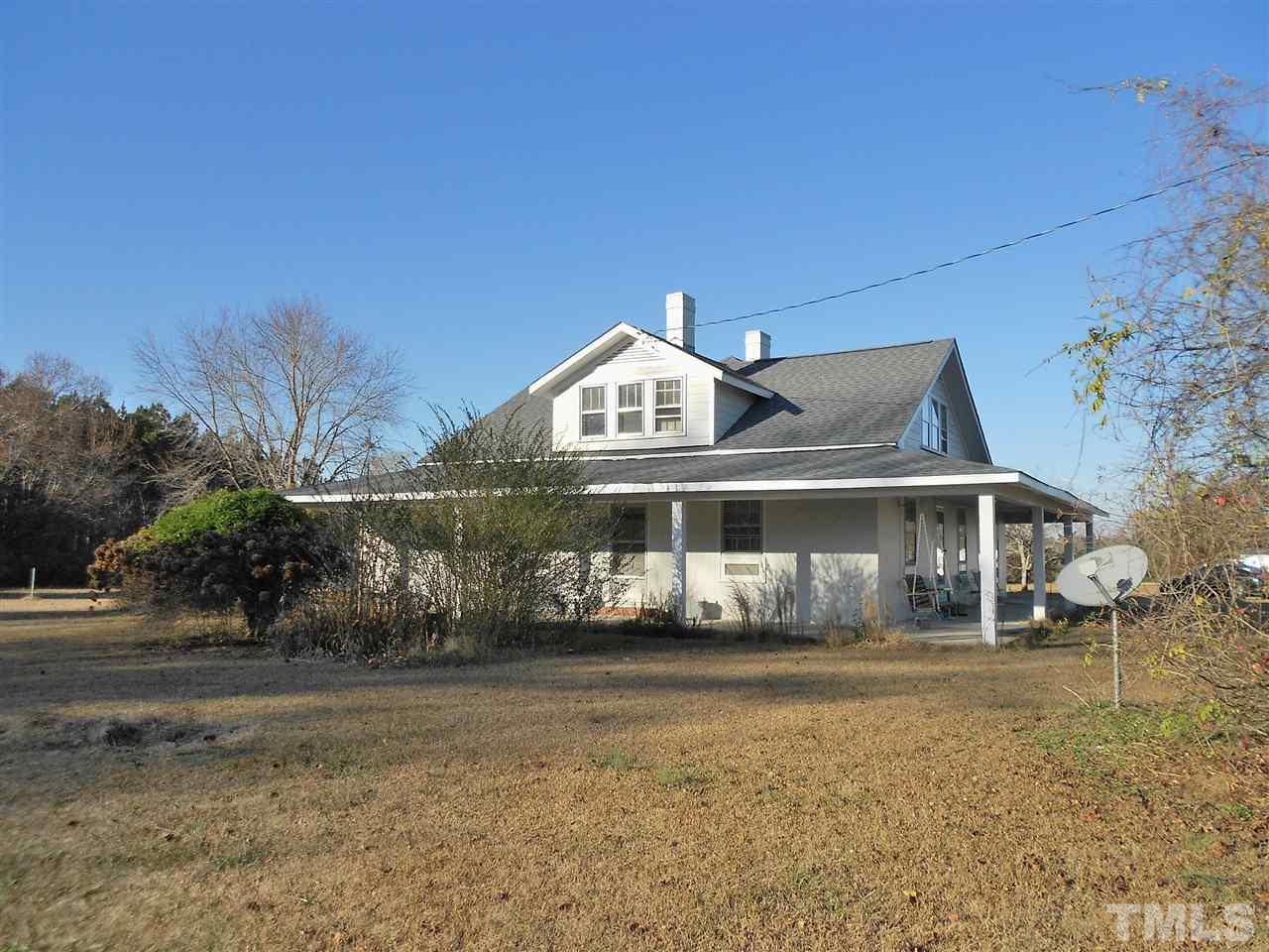 9408 Walter Myatt Road Fuquay-Varina, NC 27526 - Photo 2 of 25 a front view of a house with a yard