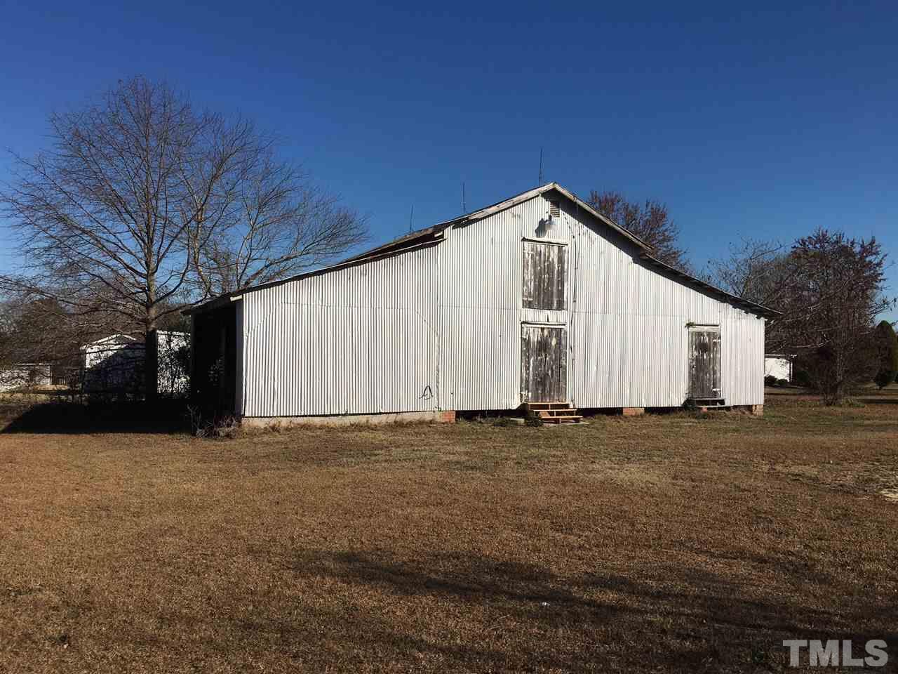 9408 Walter Myatt Road Fuquay-Varina, NC 27526 - Photo 19 of 25 a view of a house with a yard