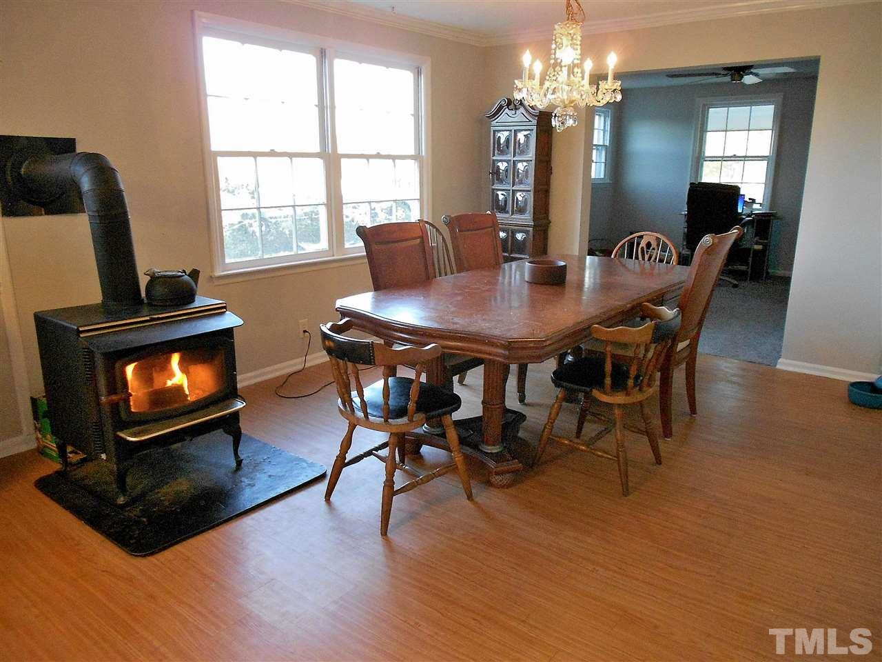 9408 Walter Myatt Road Fuquay-Varina, NC 27526 - Photo 6 of 25 a view of a dining room with furniture window and wooden floor