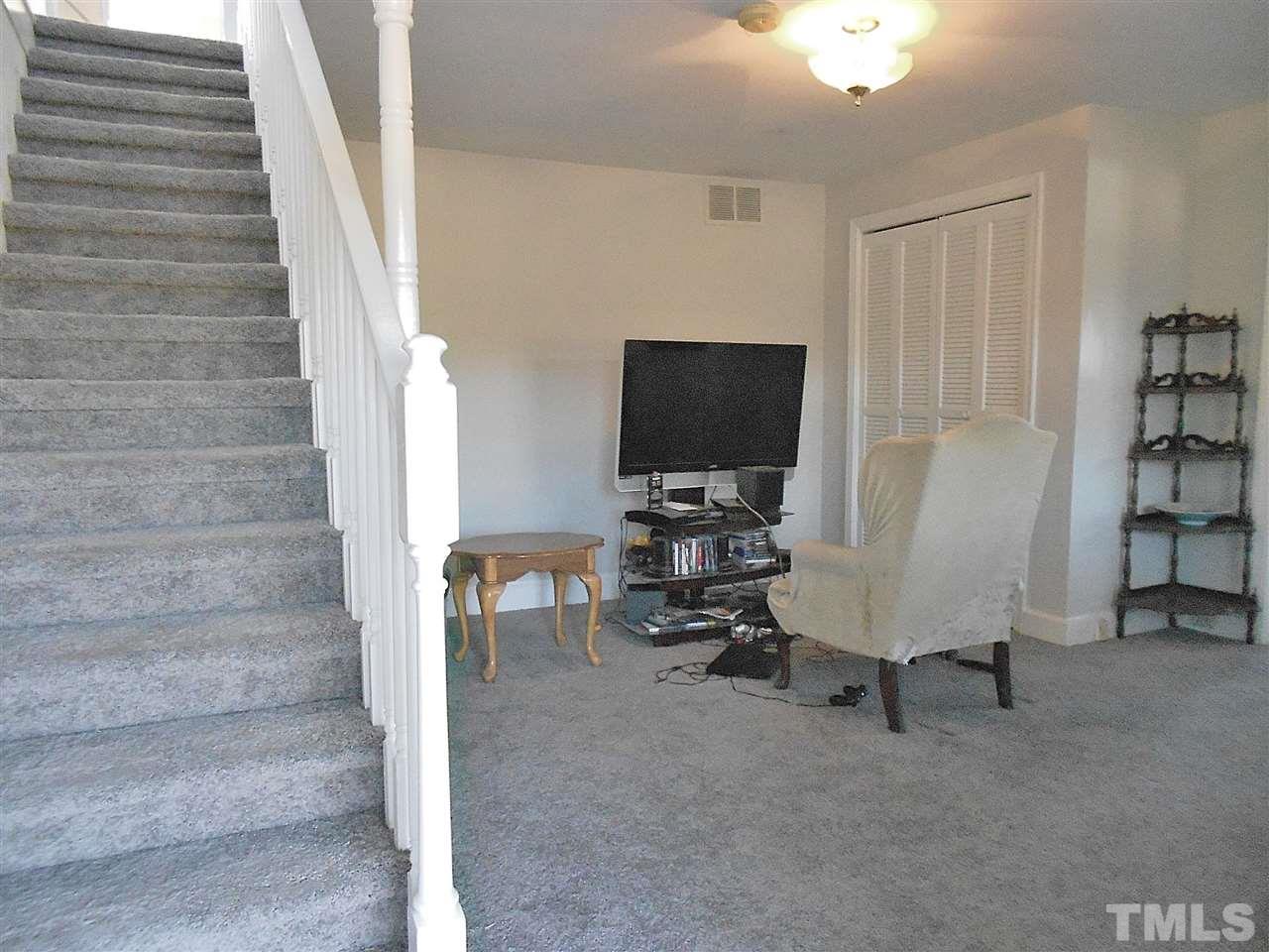 9408 Walter Myatt Road Fuquay-Varina, NC 27526 - Photo 8 of 25 a view of livingroom with furniture and workspace
