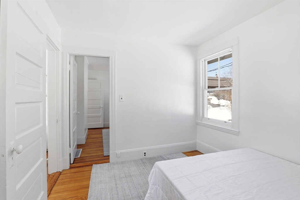 2 Cliff Road Hingham, MA 02043 - Photo 11 of 22 a bedroom with a bed and a window