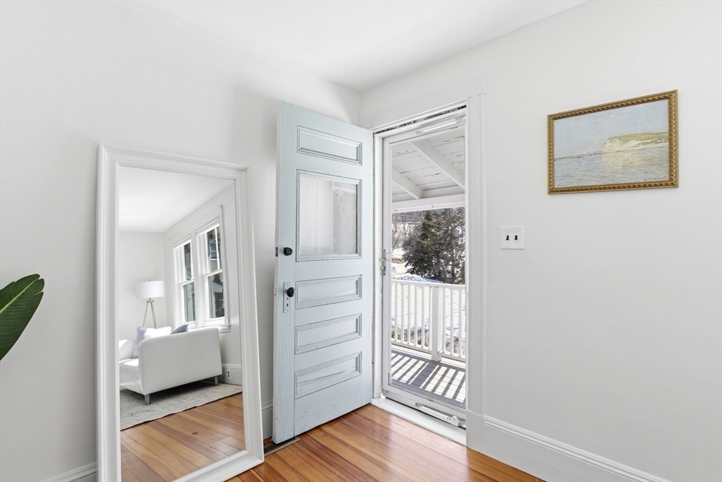 2 Cliff Road Hingham, MA 02043 - Photo 17 of 22 a view of a hallway with wooden floor and a bathroom