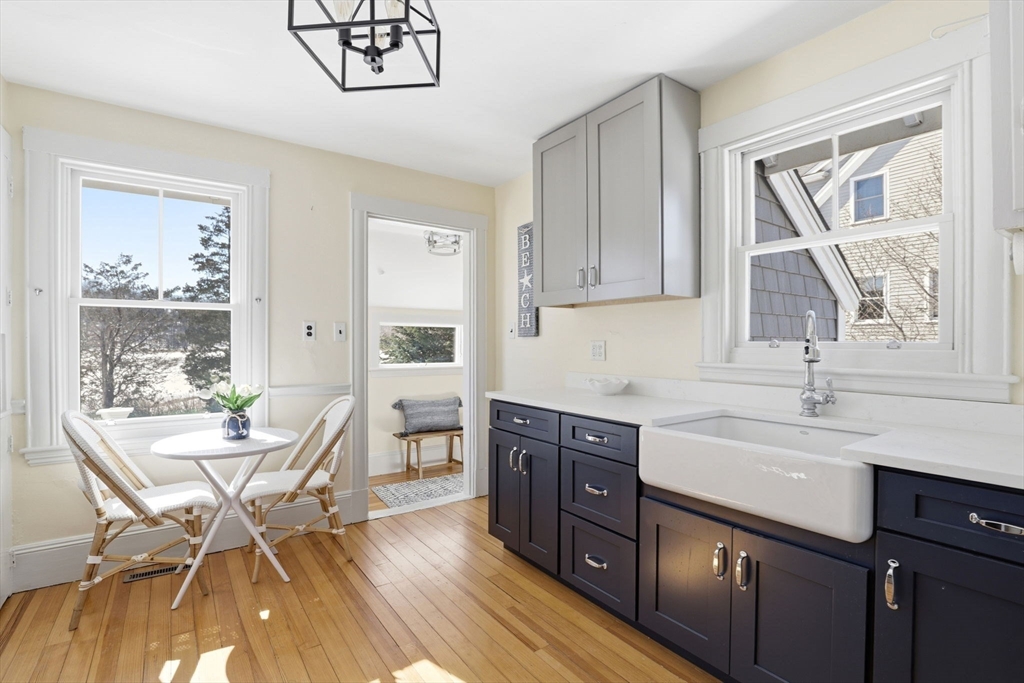 2 Cliff Road Hingham, MA 02043 - Photo 2 of 22 a kitchen with a table chairs stove and cabinets