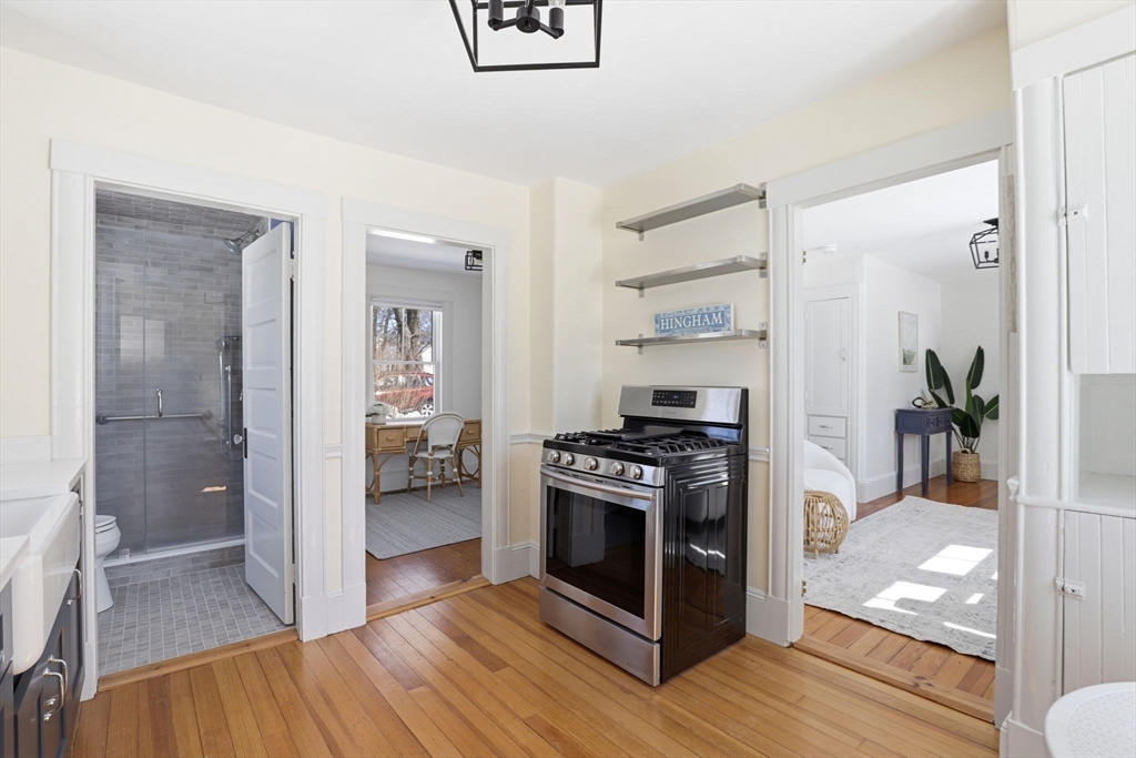 2 Cliff Road Hingham, MA 02043 - Photo 9 of 22 a kitchen with stainless steel appliances a stove and a refrigerator