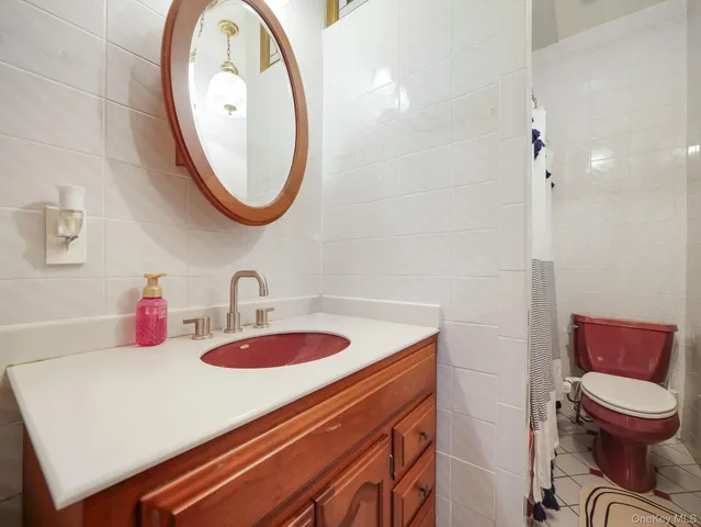 a view of a livingroom with furniture window and wooden floor