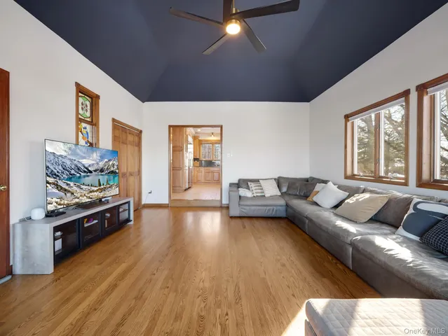 a spacious bathroom with a shower a sink and mirror