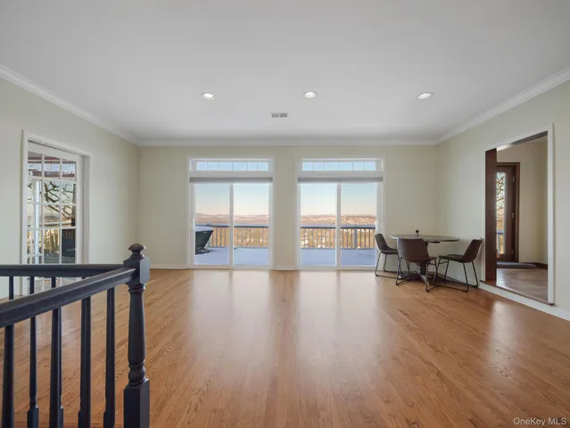an aerial view of residential houses with city view