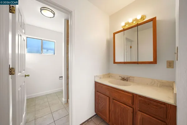 a view of a yard with wooden fence