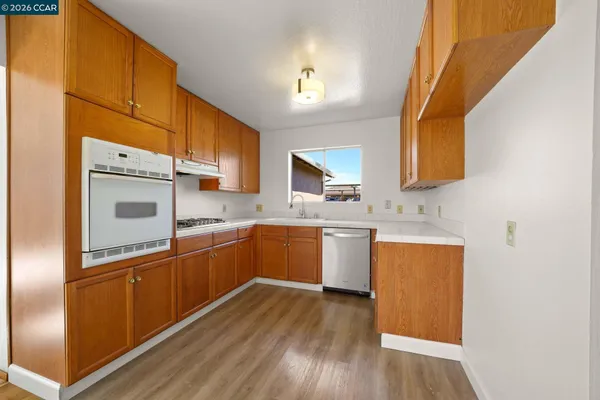 a bathroom with a sink a mirror and a vanity