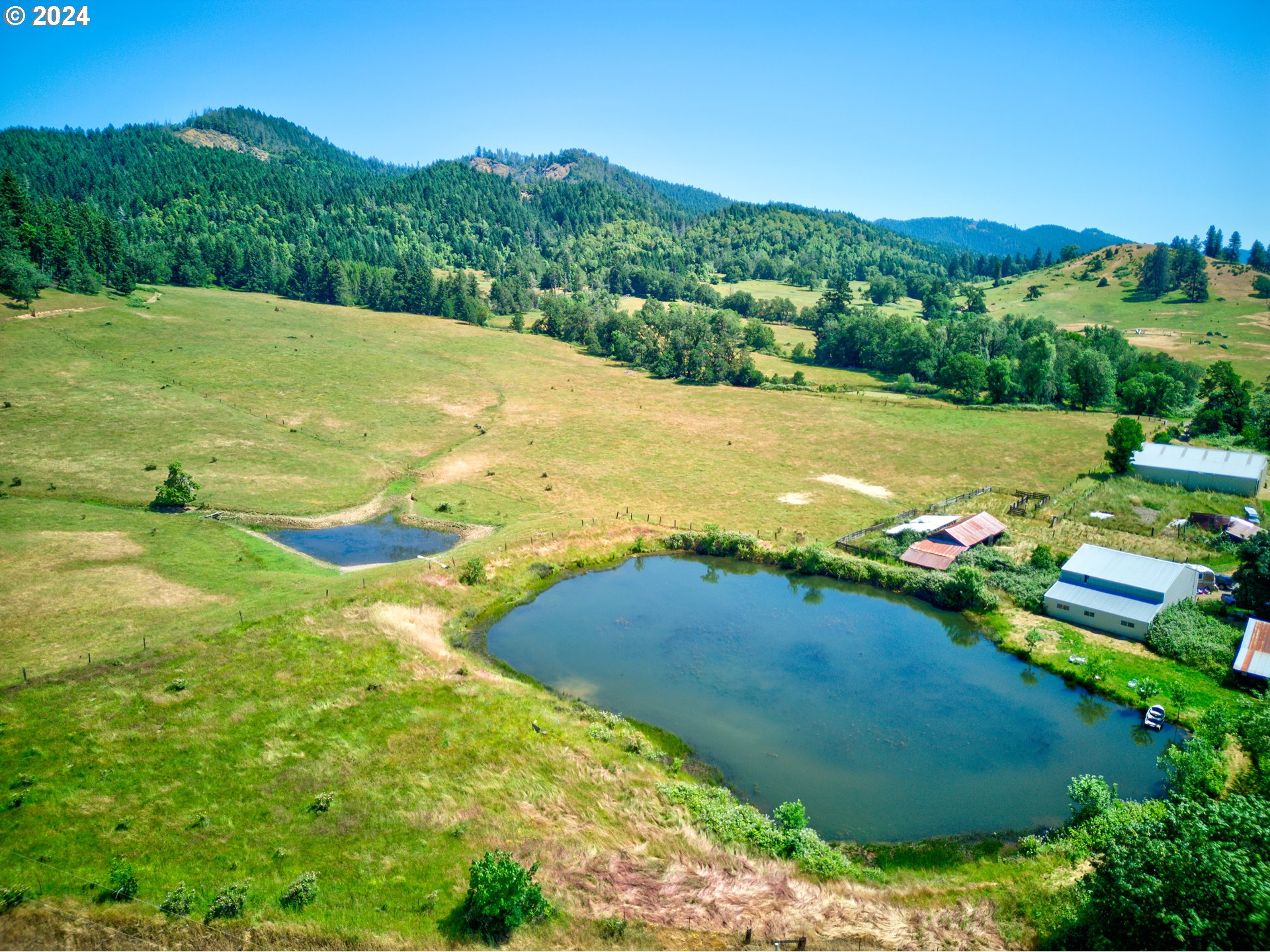 1161 Reston Road Tenmile, OR 97481 - Photo 23 of 32 a view of a golf course with a lake