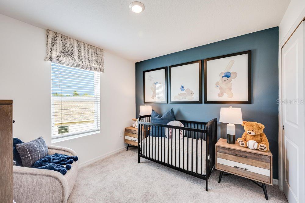 12486 Whisk Court Hudson, FL 34669 - Photo 11 of 29 a bedroom with furniture and a window