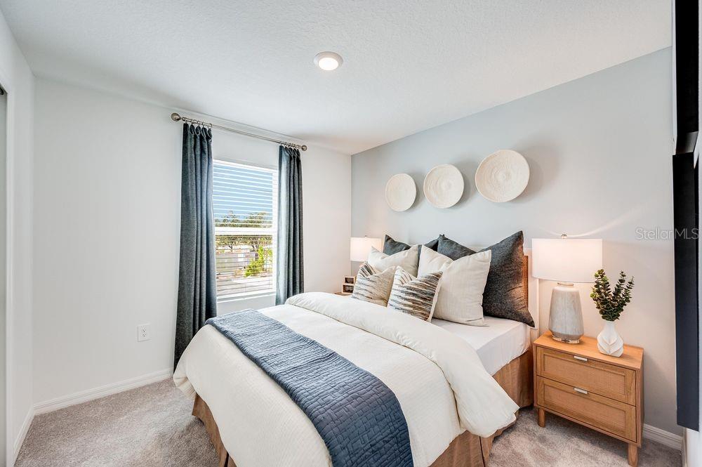 12486 Whisk Court Hudson, FL 34669 - Photo 10 of 29 a bedroom with bed and window