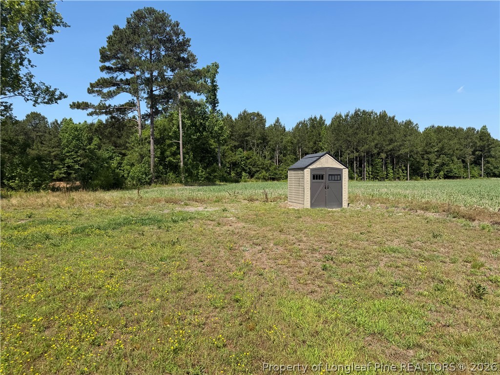 4339 Saddletree Road Lumberton, NC 28360 - Photo 2 of 23 a house view with a garden space