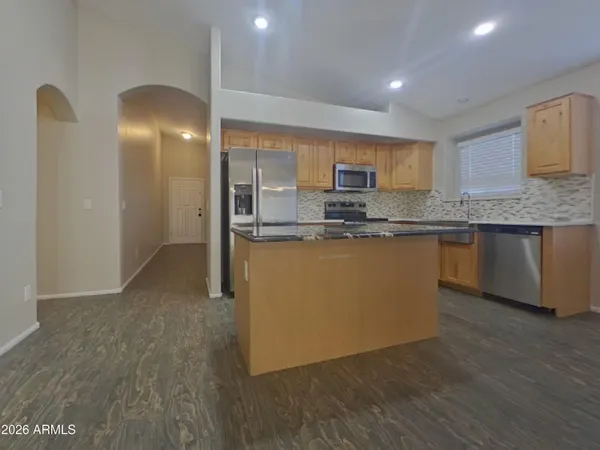 a view of empty room with a fireplace