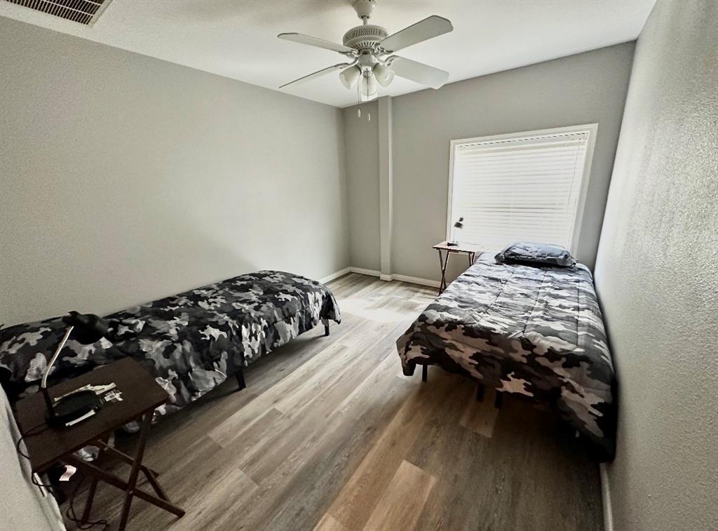 5205 Hudson Bend Road Austin, TX 78734 - Photo 17 of 21 a bedroom with a bed and window