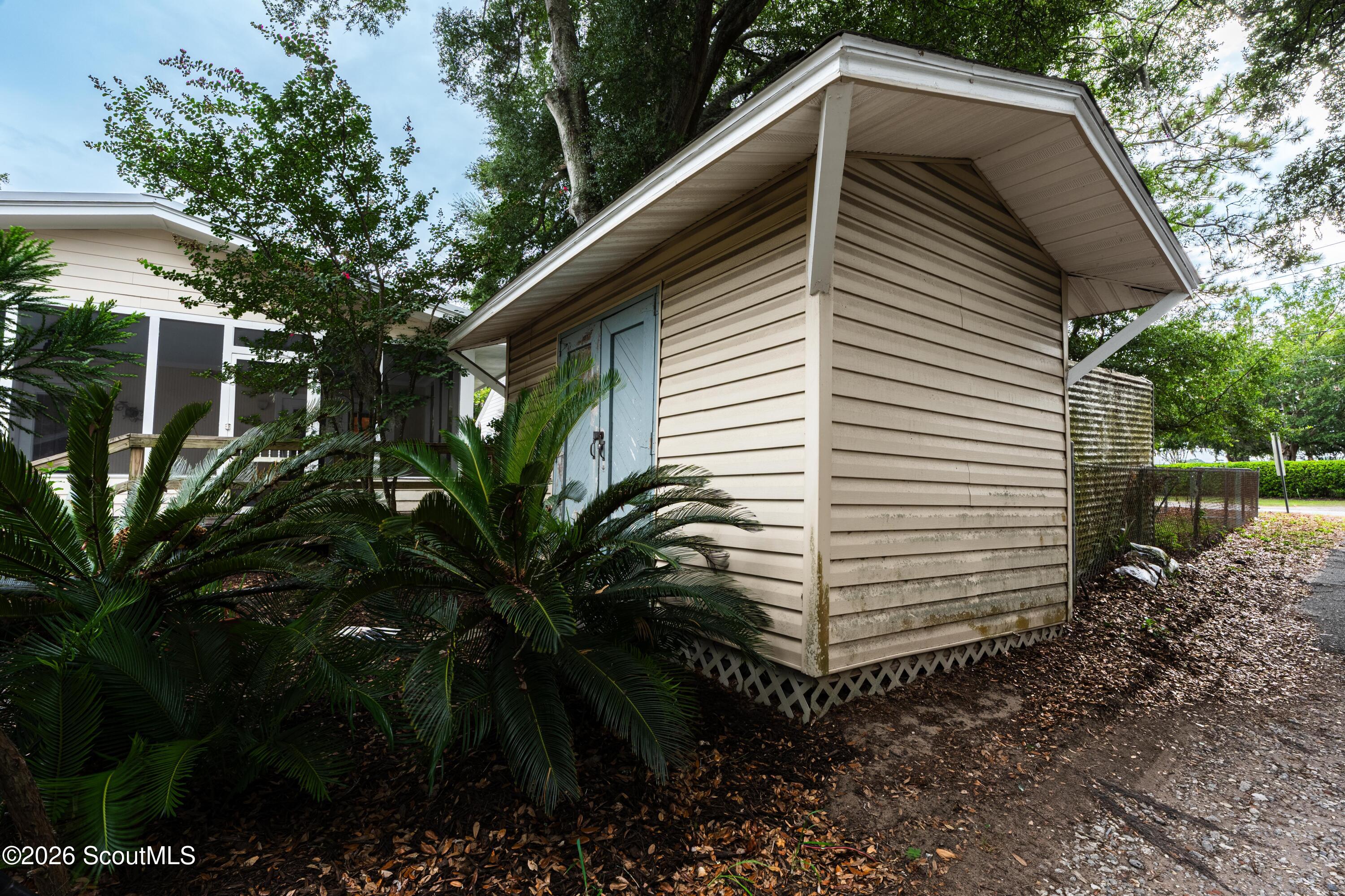 11932 Old Demere Road St. Simons Island, GA 31522 - Photo 8 of 37 shed and ally to parking