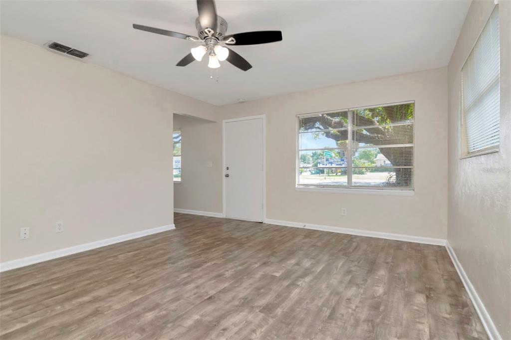 126 Kingsway Road Brandon, FL 33510 - Photo 14 of 42 a view of an empty room with a window