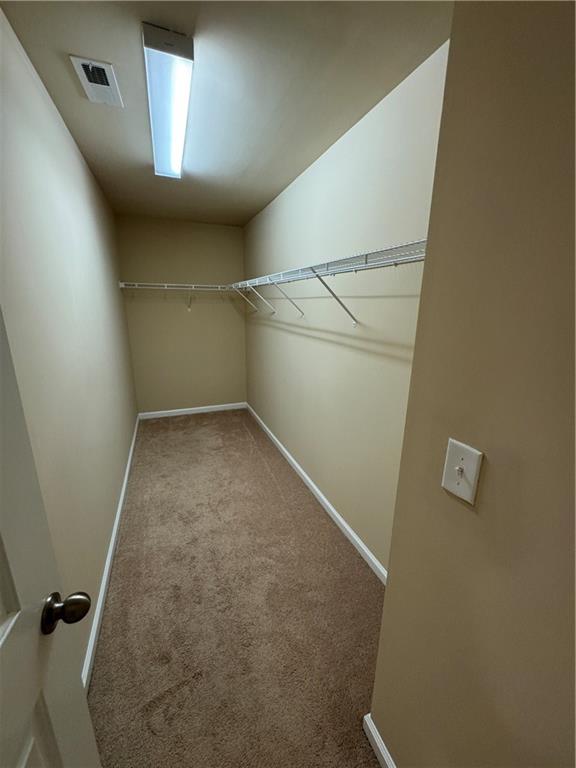 4390 Cedar Bridge Walk Suwanee, GA 30024 - Photo 11 of 14 a view of a room with rack on the wall