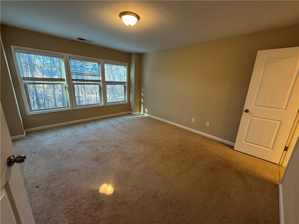 4390 Cedar Bridge Walk Suwanee, GA 30024 - Photo 13 of 14 an empty room with windows