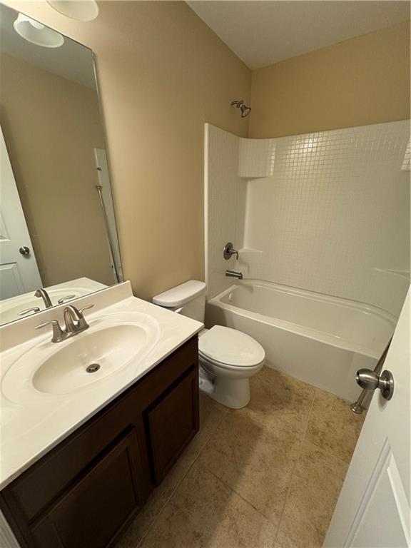 4390 Cedar Bridge Walk Suwanee, GA 30024 - Photo 7 of 14 a bathroom with a sink a toilet and shower