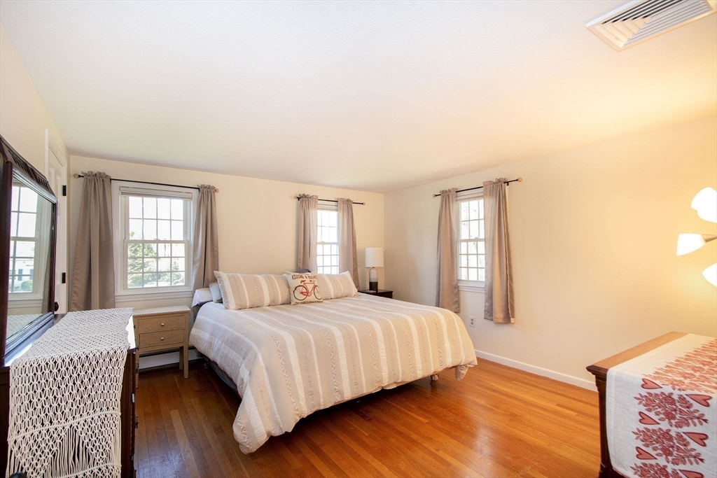 18 Longmeadow Road Scituate, MA 02066 - Photo 23 of 37 a bedroom with a large bed and a couch
