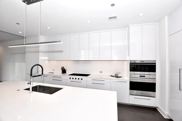 a view of kitchen with cabinets and wooden floor