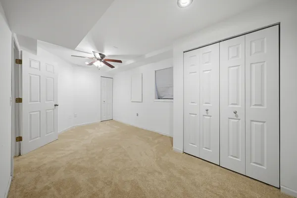 a view of a livingroom with a chandelier fan